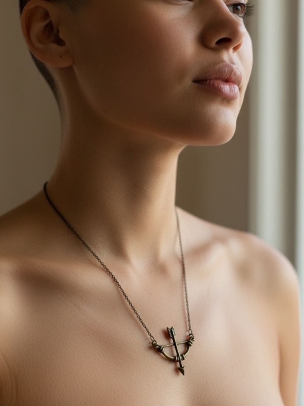 Delicate Crossbow Pendant Necklace in Antique Bronze